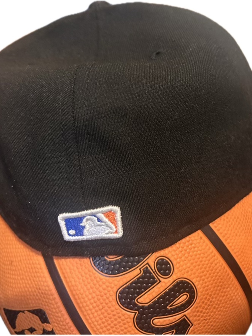 MLB Black Cap with Embroidered Logo and Orange Accent